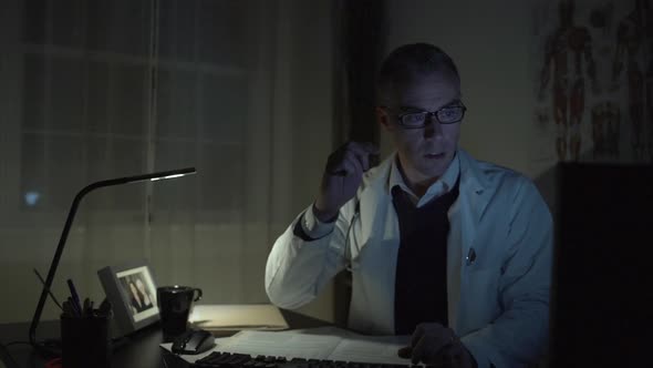 Doctor Working At His Office Desk 7 alt