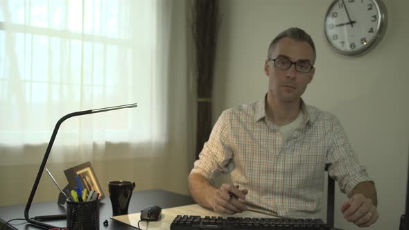 A Man Working At His Office Desk 1