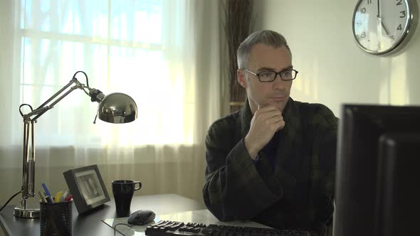 Thinking Man At His Office Desk