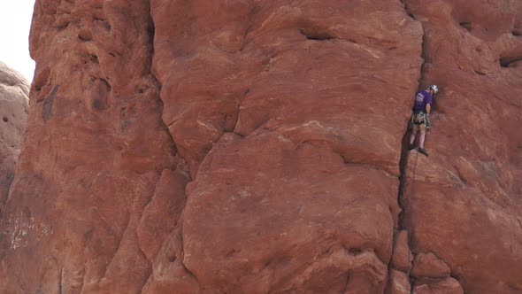 View Of A Rock Climber In Arches National Park 3 alt