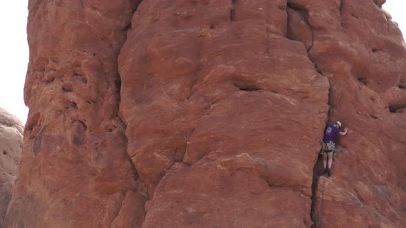 View Of A Rock Climber In Arches National Park 4 alt