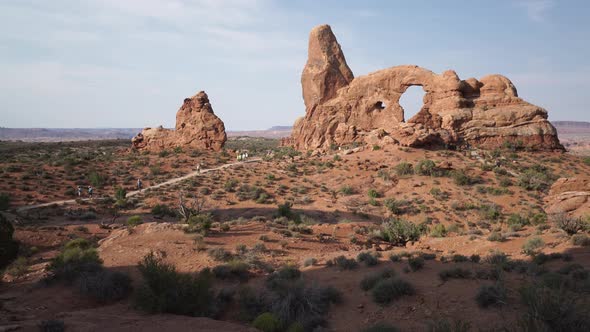 Crane Shot Of A Woman Admiring View In Arches National Park 1