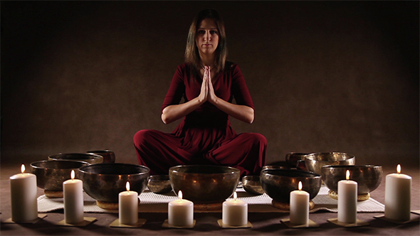 Woman Playing a Singing Bowls 