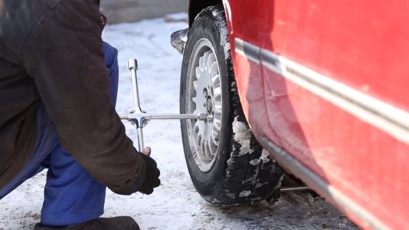 Worker Untwists Wheel