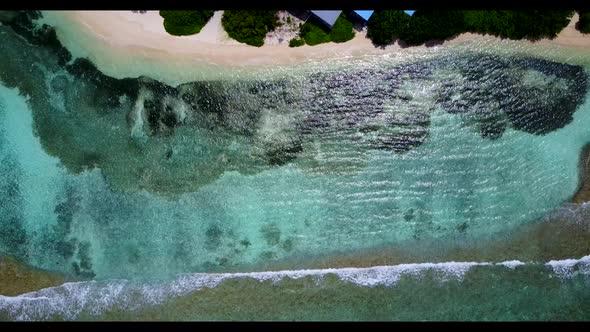 Aerial view landscape of tranquil coastline beach voyage by blue green sea with white sandy backgrou