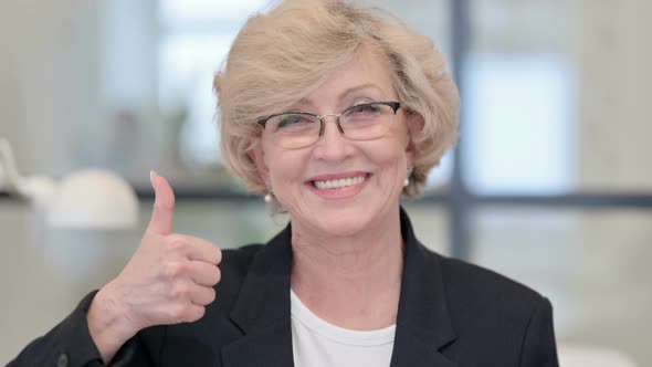 Portrait of Old Businesswoman Showing Thumbs Up Sign