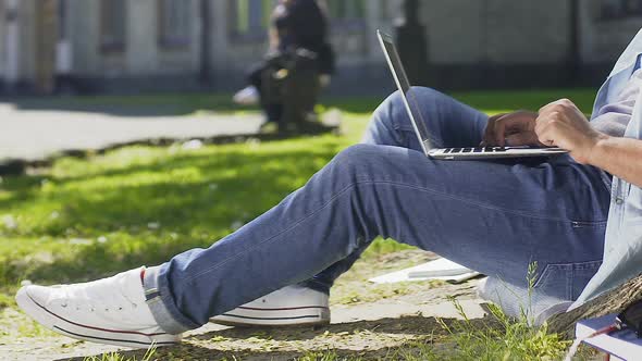 Student Working on His Diploma Project Outdoors, Drawing Inspiration From Nature