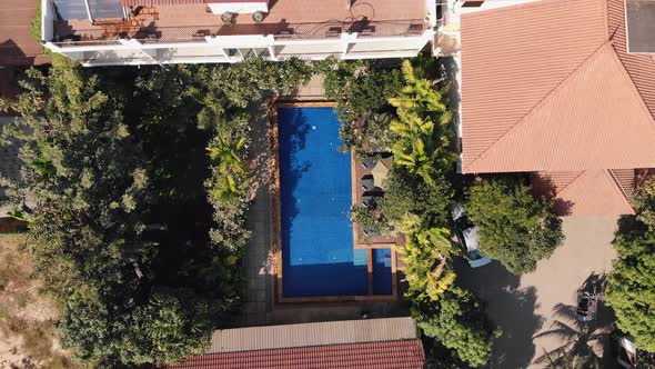 Ascending Drone Shot of a Tropical Hotel Grounds and Swimming Pool