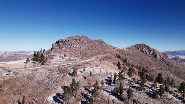 Distant drone shot of Monjeau Peak in New Mexico in the winter