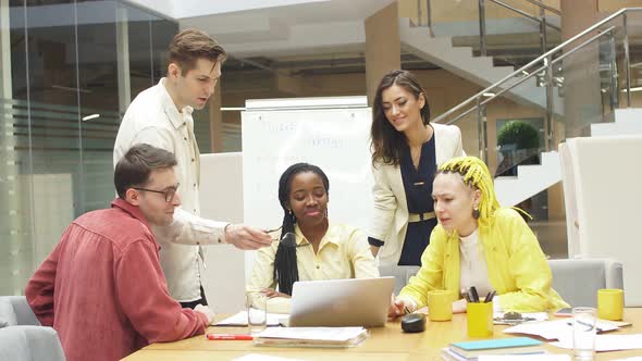 Hardworking Business People Having Discussion with Colleagues in Office.