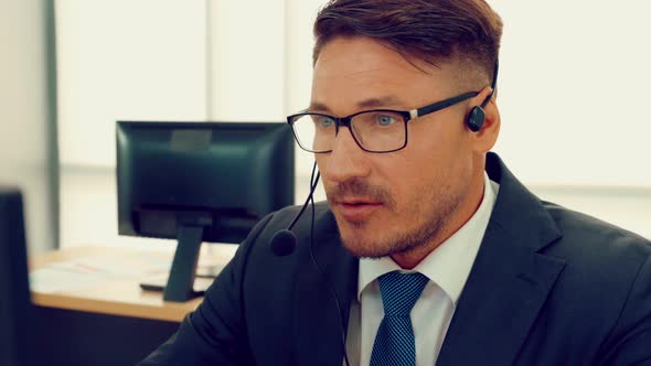 Business People Wearing Headset Working in Office