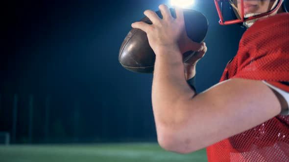 American Football Player Ready To Throw a Ball, Close Up