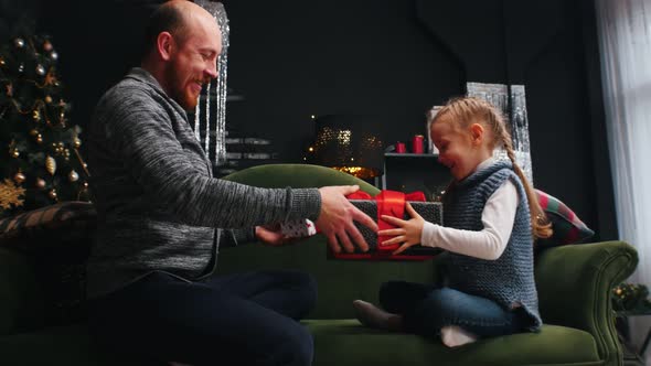 New Year - Dad and Daughter Is Exchanging New Year Gifts