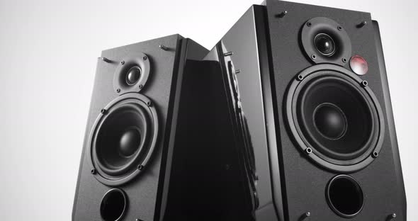 Panorama of Two Black Speakers with Vibrating Bass