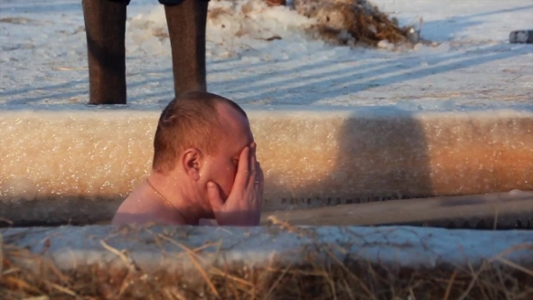 The  Man Bathes In An Ice-hole On The Epiphany In Russia