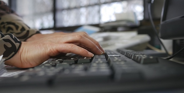 Woman Typing on Office Keyboard 