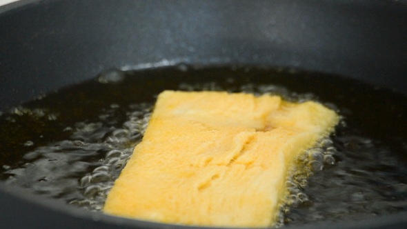Frying Toast in Pan with Boiling Oil.