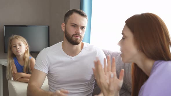 Caucasian Couple Mad at Each Other in Living Room