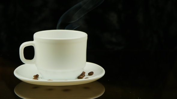 A Cup Of Hot Coffee On a Black Background alt
