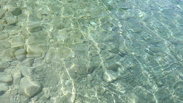 Sea Surface With Transparent Water And Stones On Bottom