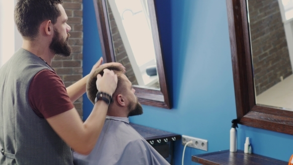 Friendly Bearded Man Barber Makes Hairstyle