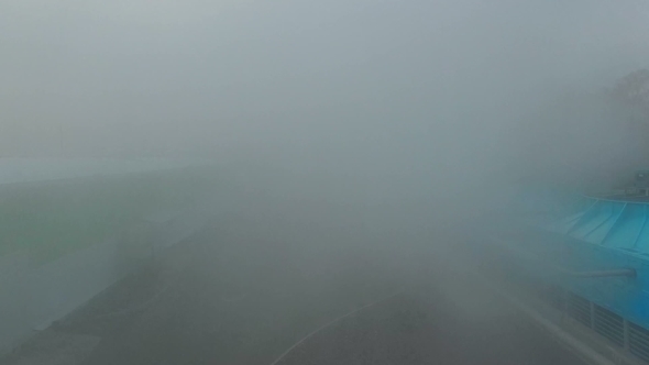 Quadrocopter Flying Through The Steam At Factory alt