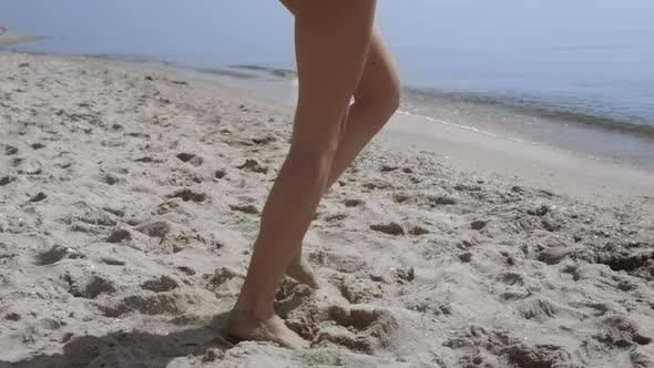 Bare Woman Legs Stepping on Sand Beach Close Up