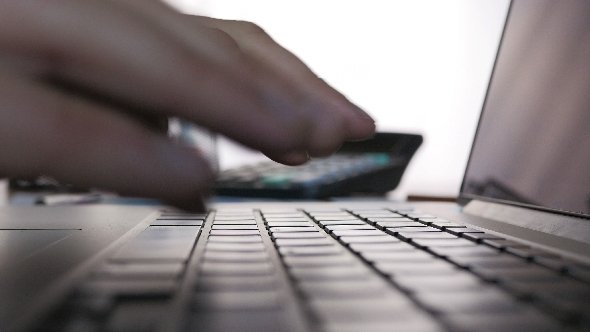 Keyboard Typing On A White Brick