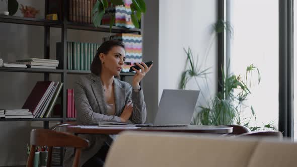 Woman Holding Smartphone Device Using Voice Recognition Function Recording Audio Message or Talking