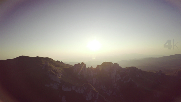 Above the Mountains at Sunrise in the Summer