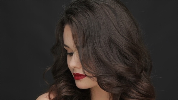 Attractive Girl Straightens Her Hair alt