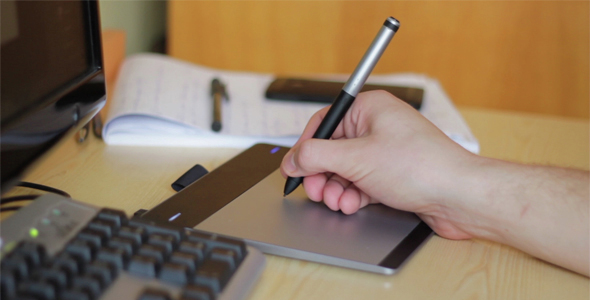 Designer Working on a Graphic Pen Tablet