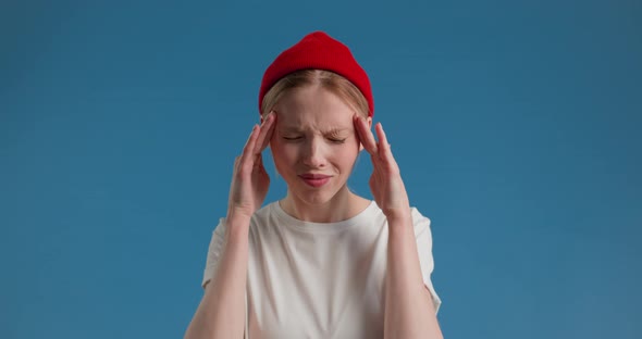 Closeup Exhausted Woman with Migraine Posing at Camera