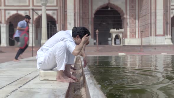 Muslim men cleaning himself before ramadan