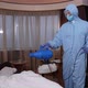 Equipped Man with Sprayer Disinfecting Hotel Room - VideoHive Item for Sale