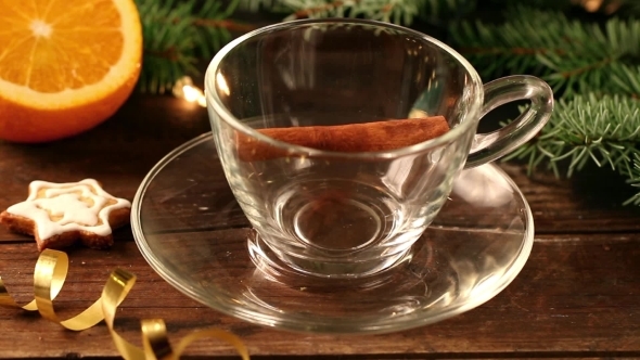 Mulled Wine With Spices Pouring Into Glass Cup