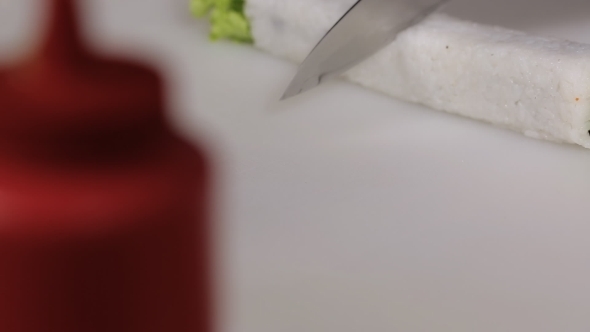 Cooking Sushi Rolls, Cutting Into Portions 