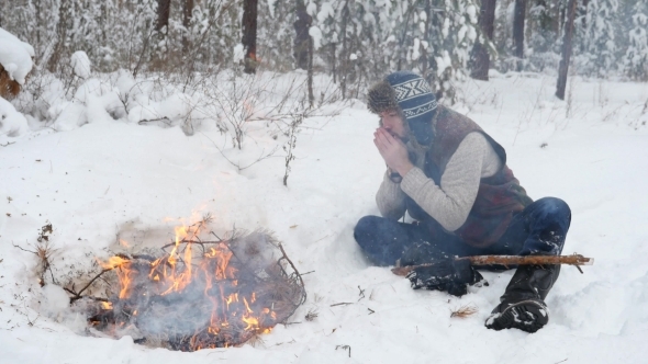 Man Warm Hands By Winter Campfire