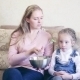 Woman With Her Daughter Eat Salad - VideoHive Item for Sale