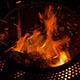 Throwing Wood into a Fire at Night - VideoHive Item for Sale