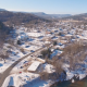 Aerial of Small Town in Mountains with Snow - VideoHive Item for Sale