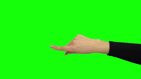 Arm in Black Sweater Pointing Something. Green Screen. Close Up