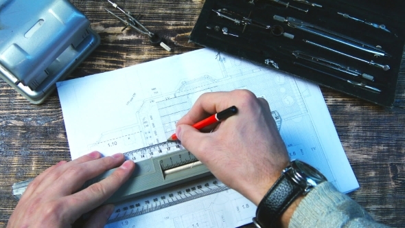 Drawing a Pencil Line On The Ruler On The Drawing Sheet