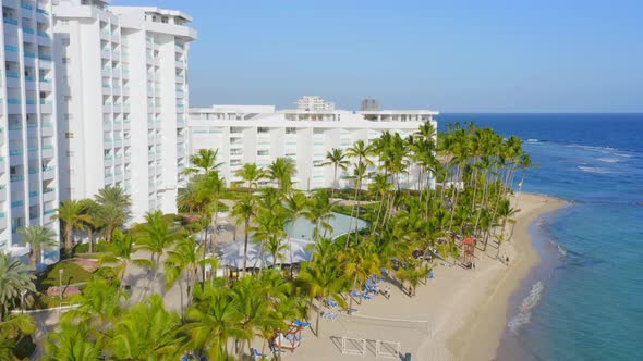 Marbella seafront hotel, Juan Dolio in Dominican Republic. Aerial backward