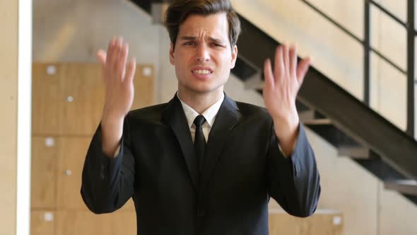 Unsatisfied Businessman Angry with Teammates, Screaming