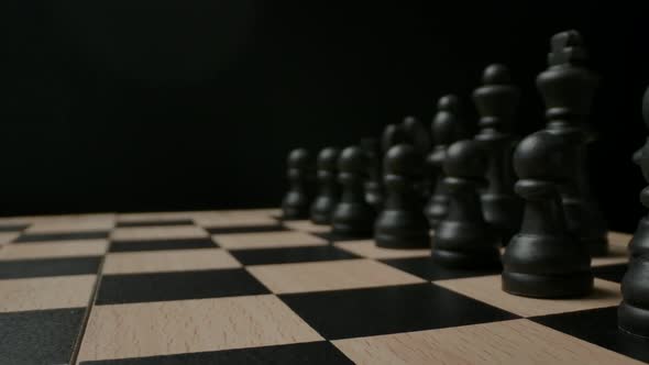 Black Chess Pieces on Black and White Checkerboard