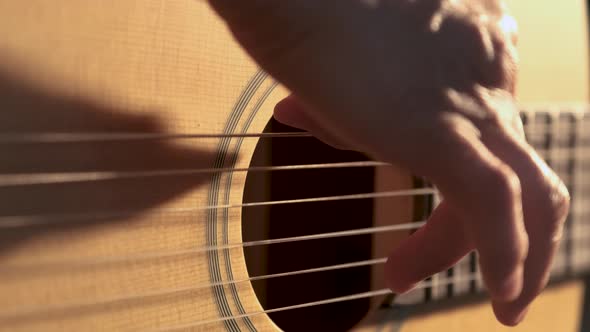 Teen Girl Playing Acoustic Guitar Close Up