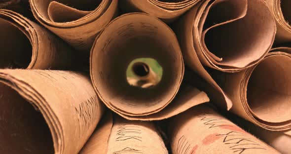 Ancient scribe library. Futhpak scrolls stacked on a pile.