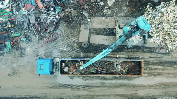 Top View of a Truck Getting Loaded with Scrap Metal