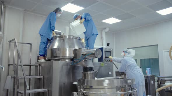 Man Pours the Liquid Substance to Automated Machine for Mixing and Making Drugs